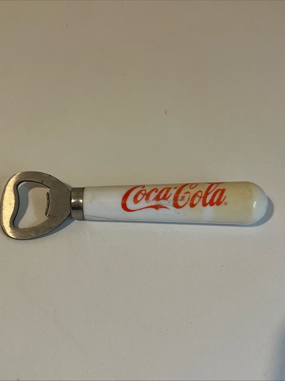 Vintage Coca-Cola Branded Bottle Opener Red Script Writing White Handle 5.5”